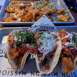 Shrimp, steak, fish tacos with loaded waffle fries.