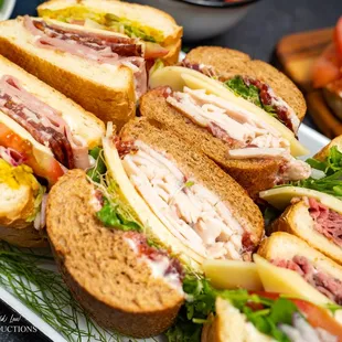 a platter of sandwiches on a table