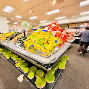 people shopping in the produce section