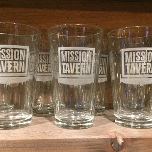 a row of glasses on a shelf