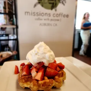 Belgian liege waffle with fresh Strawberries and house made whip!