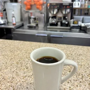 Hot coffee. Note the fresh-squeezed orange juicer in the background!
