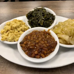 sides: macaroni and cheese, collard greens, fried cabbage, and baked beans. With sweet tea