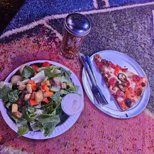 a salad and a slice of pizza