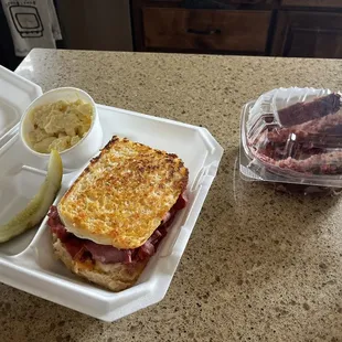Grilled sourdough, corned beef, provolone, and thousand Island dressing. The best potato salad! And one delicious slice of red velvet cake.