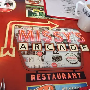 a menu and a cup of coffee