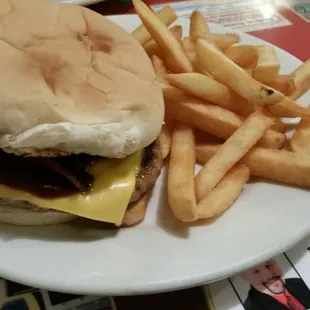 Solid burger with bacon, BBQ &amp; coleslaw on it.