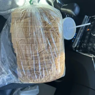 a loaf of bread wrapped in plastic