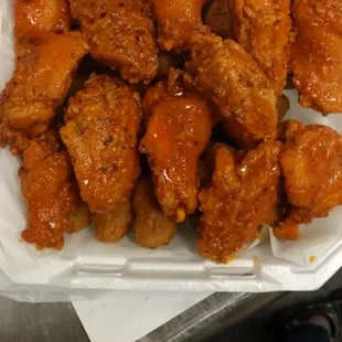 chicken wings in a styrofoam container