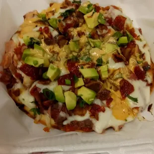 a pizza in a plastic container