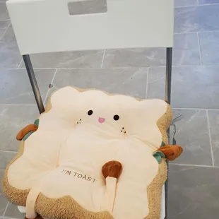 a chair with a stuffed animal on it