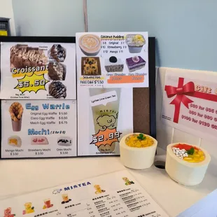 a menu and drinks on a table