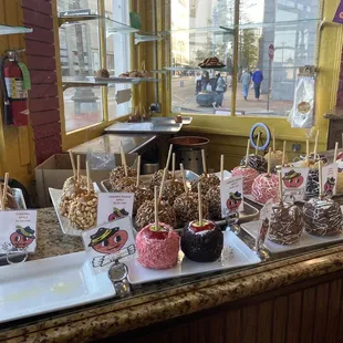 a variety of caramel apples on display