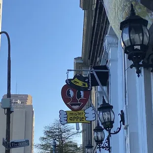 a sign for a restaurant on a city street