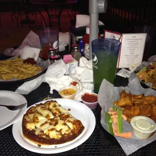 Cheese sticks, wings, and french fries.