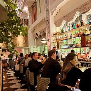 a group of people sitting at a bar