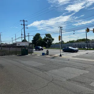 the intersection of a street and a parking lot