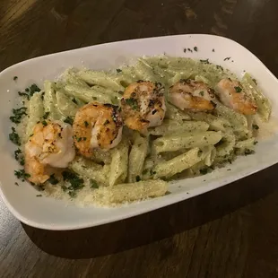 Penne pasta with creamy basil sauce and shrimp