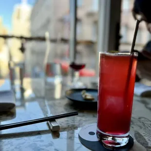 a red drink on a table