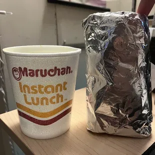 Gyro next to a ramen cup for comparison