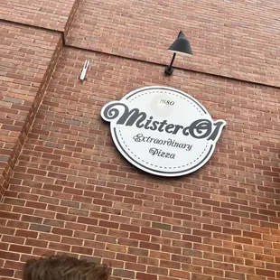 a sign on a brick building