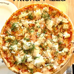 Vittoria Pizza. Ingredients: Italian tomato sauce, mozzarella, roasted chicken, Italian Parmesan, and basil.