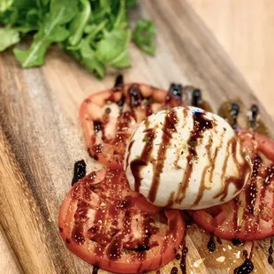 Burrata &amp; Italian Balsamic Glaze: Fresh burrata cheese, arugula, fresh tomatoes, Italian balsamic glaze served with thin crispy Focaccia (Ve