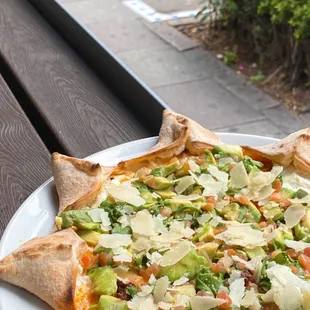 Star Carlos-Star shaped pizza filled with ricotta cheese, mozzarella, chorizo sausage, tomatoes, arugula, avo, Italian parmesan and jalapeño