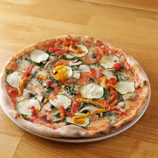 Riccardo Pizza - Italia tomato suace, mozzarella, fresh mushrooms, zucchini, spinach and roasted peppers. Vegetarian