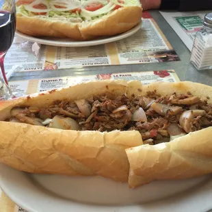 Cheese steak with onions, mushrooms and sauce. So much meat!!