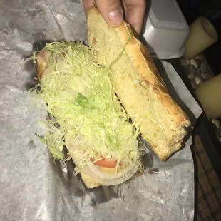 a sandwich with lettuce and tomato