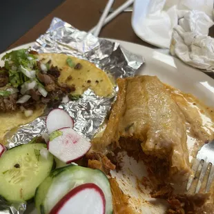 Half of my tamale and carnitas taco