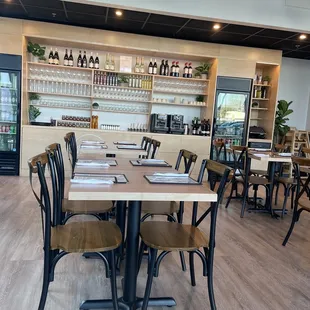 a dining area with tables and chairs