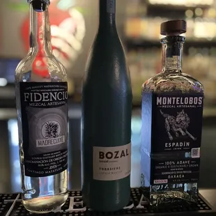 three bottles of alcohol