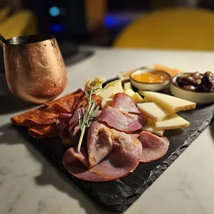 a platter of meat and cheese