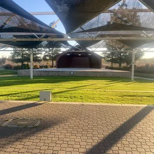 Between the field open amphitheater type area with well kept grass