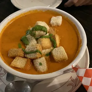 a bowl of soup with croutons