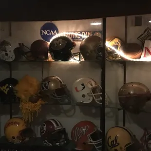 a display case full of football helmets