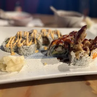 a plate of sushi with sauce