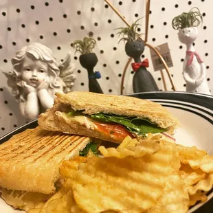 a sandwich and chips on a plate