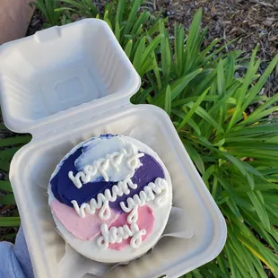 a cupcake in a styrofoam container