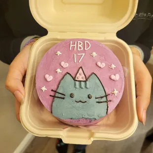 a birthday cake in a container