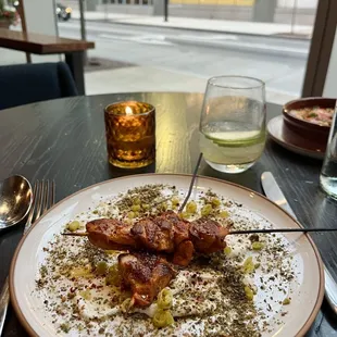 Chicken skewers with lemon yogurt and pistachio