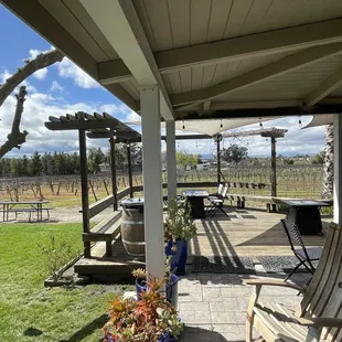 a patio with a table and chairs