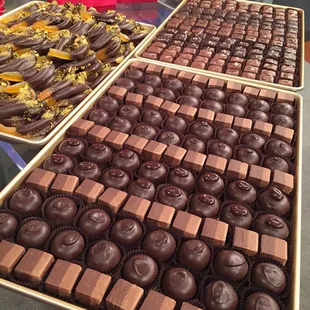 Assorted truffles, salted caramels, and hand dipped orange peel with pistachios