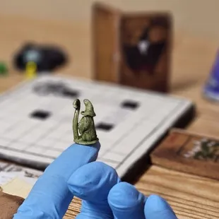 a person wearing blue gloves