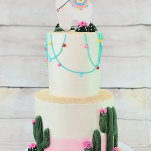 a cake with a llama on top
