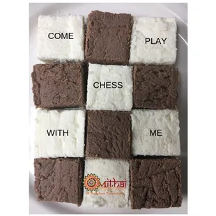 A chessboard criss cross of White and coffee chocolate sandesh!