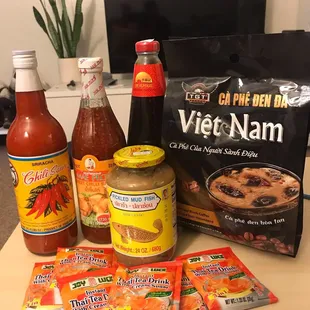 Sriracha, sweet chili, and oyster sauce with instant coffee and Thai tea packages...mmmmmmm