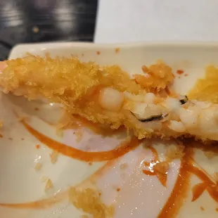a close up of a piece of mito sushi